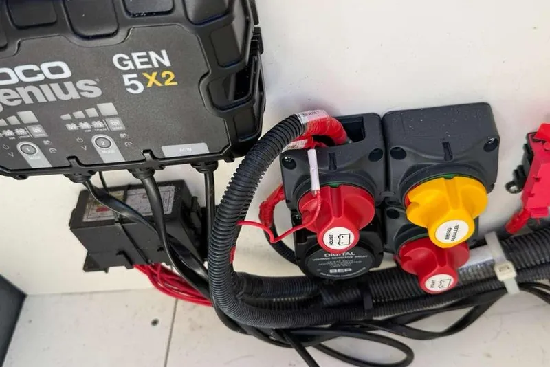 Slide: The Image of 2023 Yamaha Boats 255 FSH Sport E electrical system with NOCO Genius GEN 5X2 charger. - 31