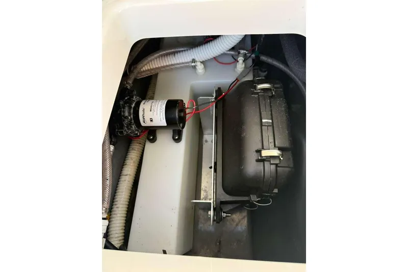 Slide: The Image of 2023 Yamaha Boats 255 FSH Sport E engine compartment with wiring and components. - 32