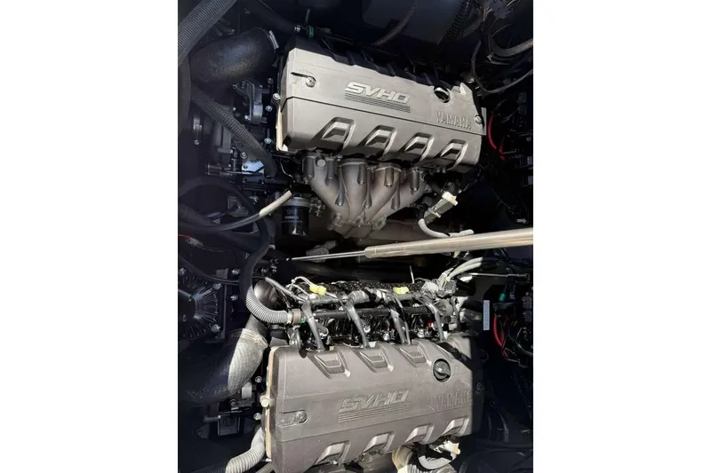 Slide: The Image of 2023 Yamaha Boats 255 FSH Sport E engine compartment with twin SVHO engines. - 33