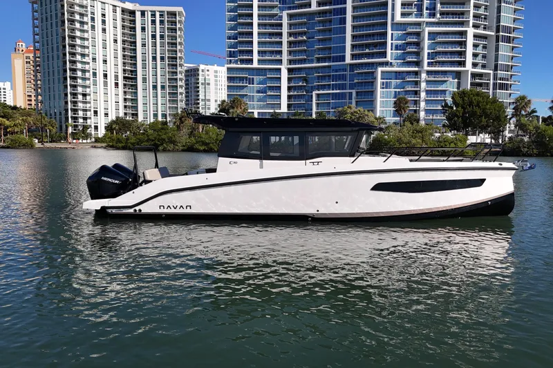 The Image of Navan C30 2026 boat on water with modern cityscape background. - 0