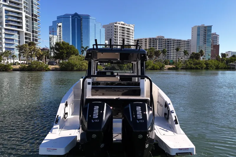 Slide: The Image of 2026 Navan C30 boat with dual engines on a city waterfront. - 11