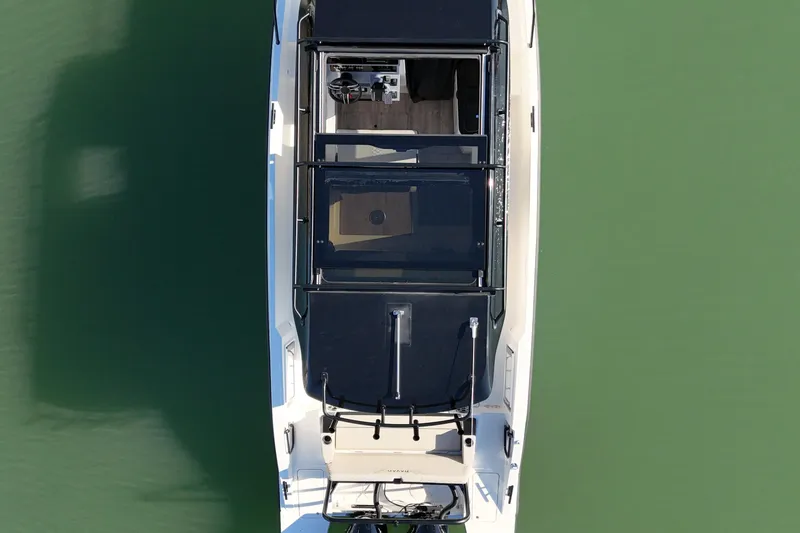 Slide: The Image of Overhead view of 2026 Navan C30 boat on calm green water. - 12