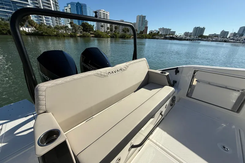 Slide: The Image of 2026 Navan C30 boat with dual engines, luxurious seating, and scenic waterfront view. - 15
