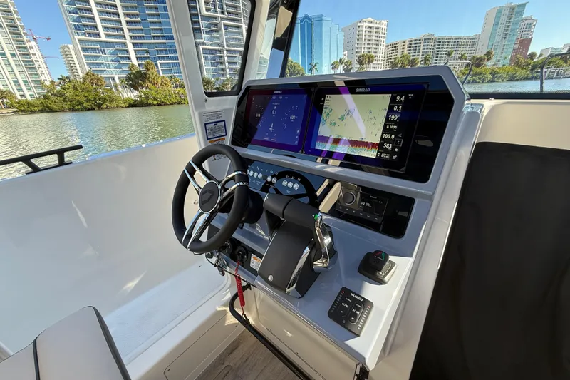 Slide: The Image of Interior of 2026 Navan C30 boat with modern navigation system and steering wheel. - 23