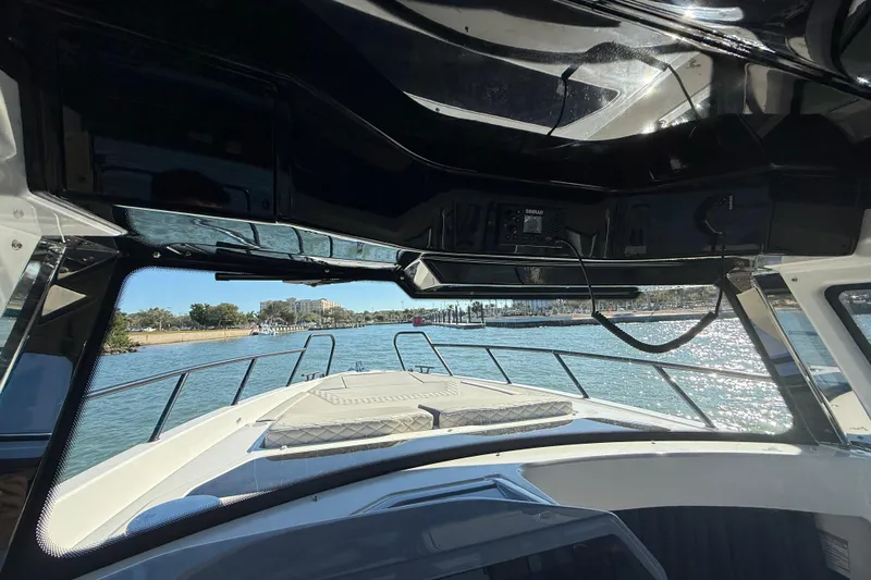 Slide: The Image of Interior view of 2026 Navan C30 boat, showcasing helm and waterfront scenery. - 25