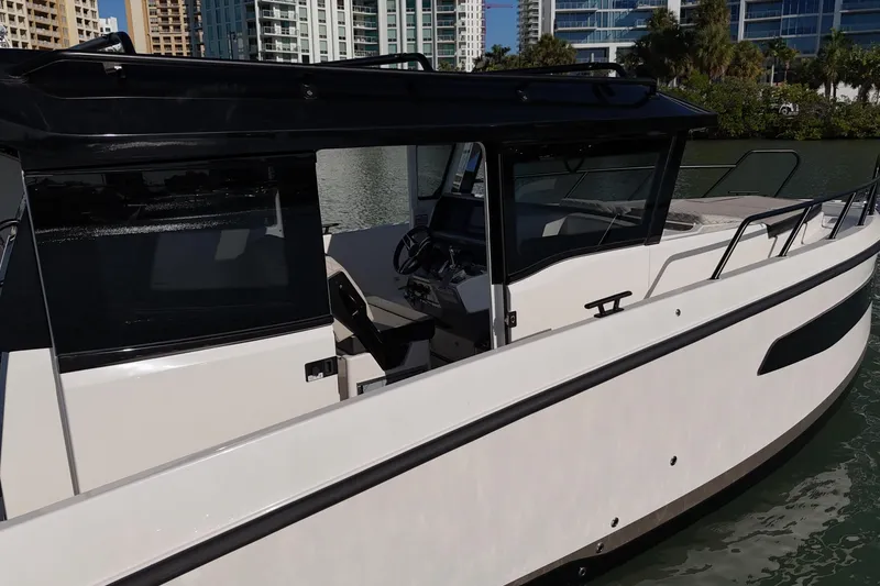 Slide: The Image of Navan C30 2026 boat docked, showcasing sleek design and modern features. - 8