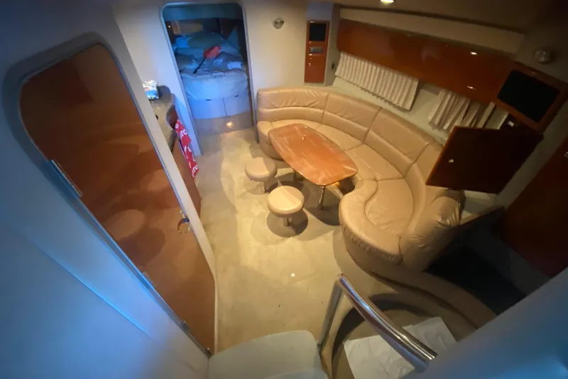 Slide: The Image of Interior of 2005 Formula 40 Performance Cruiser with beige seating and red cushion. - 27