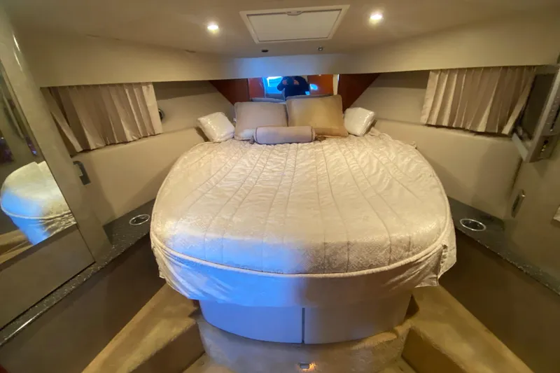 Slide: The Image of Interior of 2005 Formula 40 Performance Cruiser with bed, TV, and porthole window. - 34