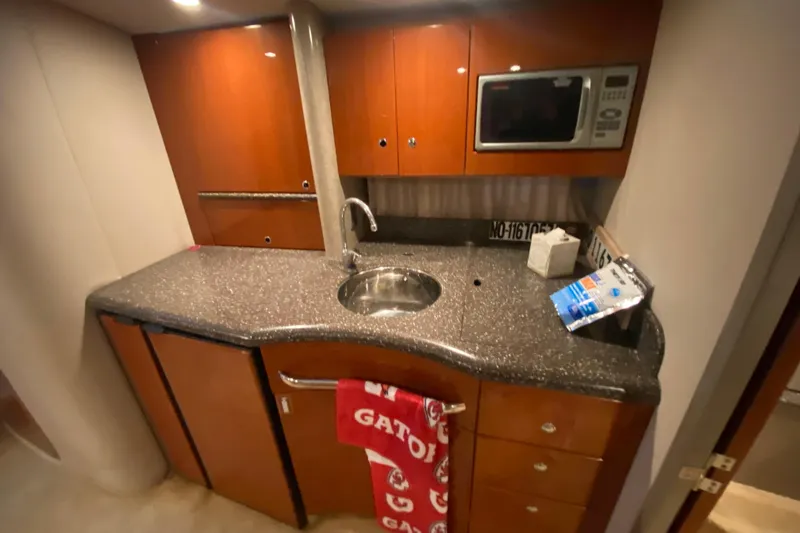 Slide: The Image of Red engine compartment of a 2005 Formula 40 Performance Cruiser with control panel. - 40