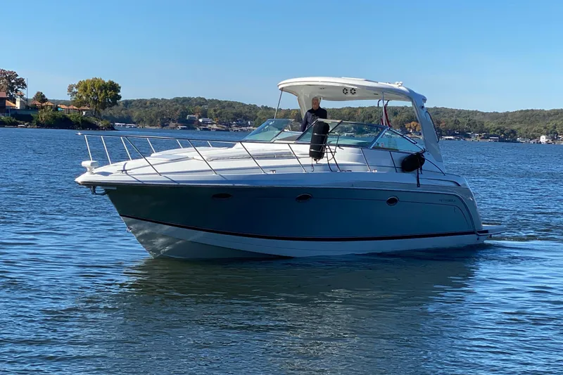 Slide: The Image of 2005 Formula 40 Performance Cruiser docked, rear view with sunlit water reflections. - 9