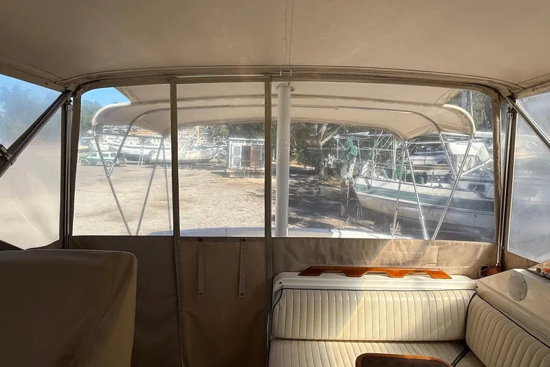 Slide: The Image of Interior view of a 1999 Sabre 36 Express boat with outdoor marina background. - 21