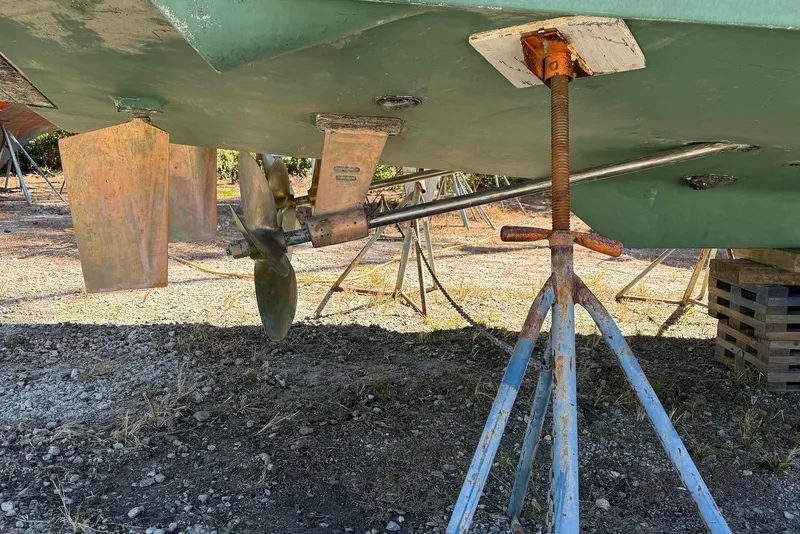 Slide: The Image of 1999 Sabre 36 Express boat propeller and rudder on dry dock support. - 44