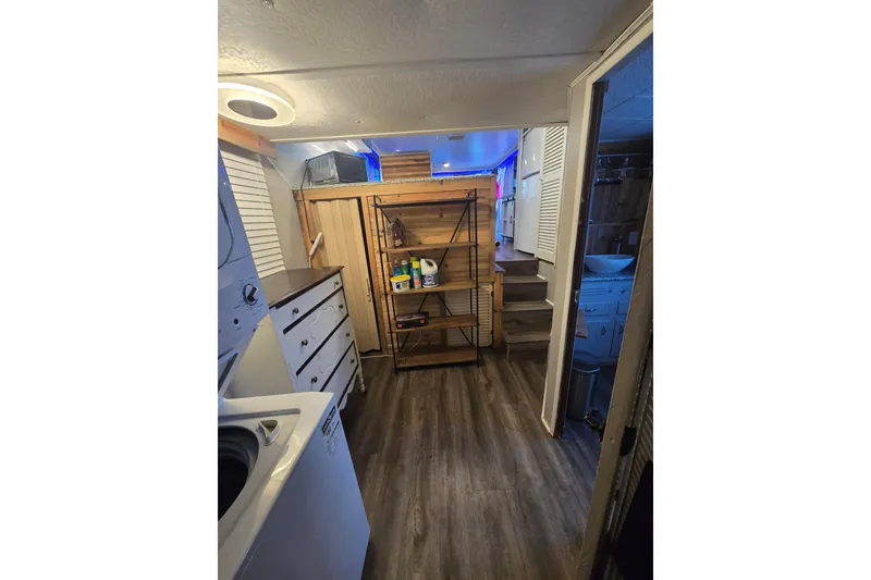 Slide: The Image of Cozy laundry room with wooden shelves, modern appliances, and ambient lighting. - 26