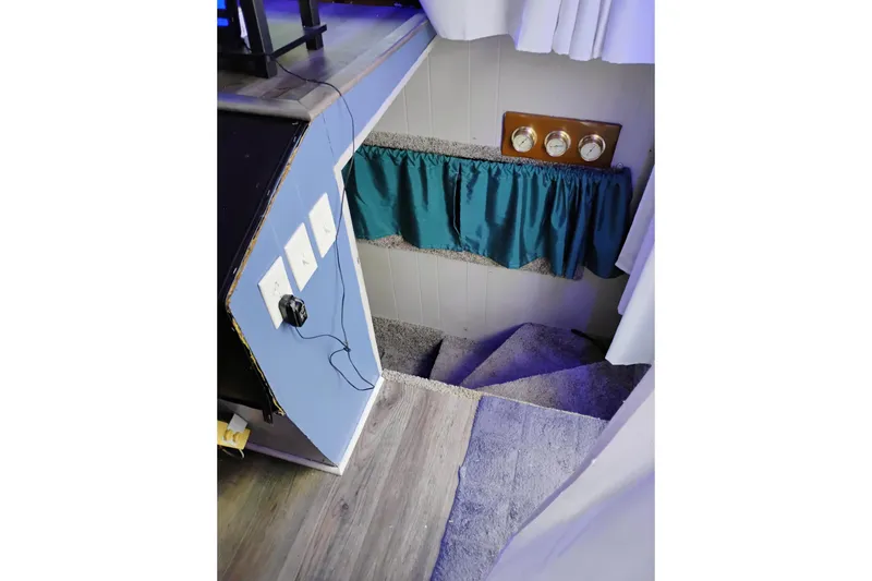 Slide: The Image of Carpeted stairs with teal curtain, wall outlets, and vintage gauges, 1977 Gibson 50 Standard. - 7