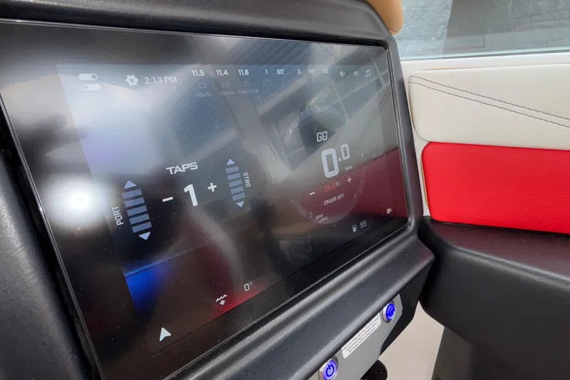 Slide: The Image of Touchscreen display in 2026 Tigé 24RZX boat, showing control settings and speedometer. - 19