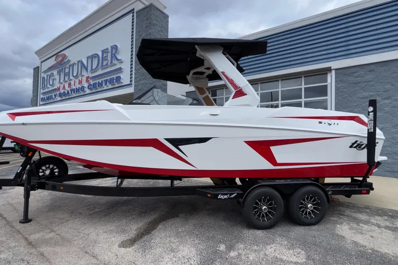 The Image of 2026 Tigé 24RZX boat with red accents on trailer at Big Thunder Marine. - 2
