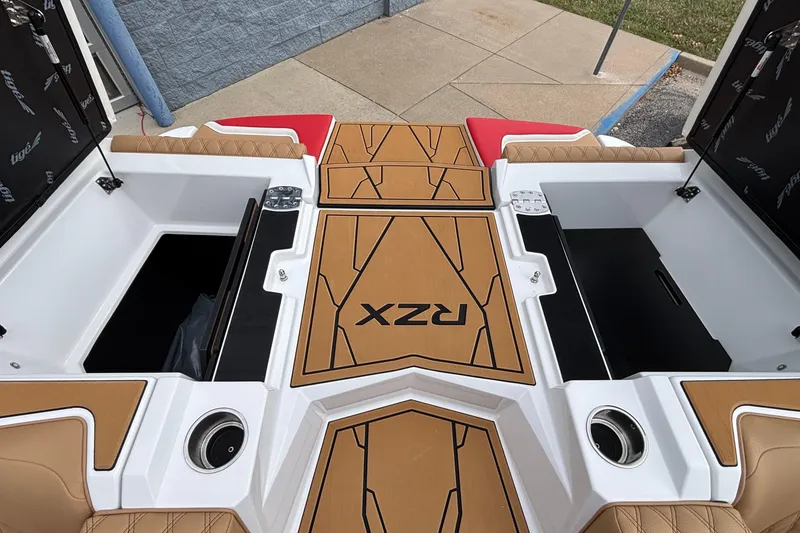 Slide: The Image of 2026 Tigé 24RZX boat interior with storage compartments and stylish seating. - 26