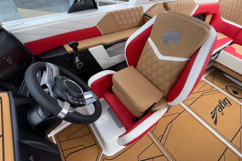 Slide: The Image of 2026 Tigé 24RZX boat interior with luxurious seating and modern steering wheel design. - 33