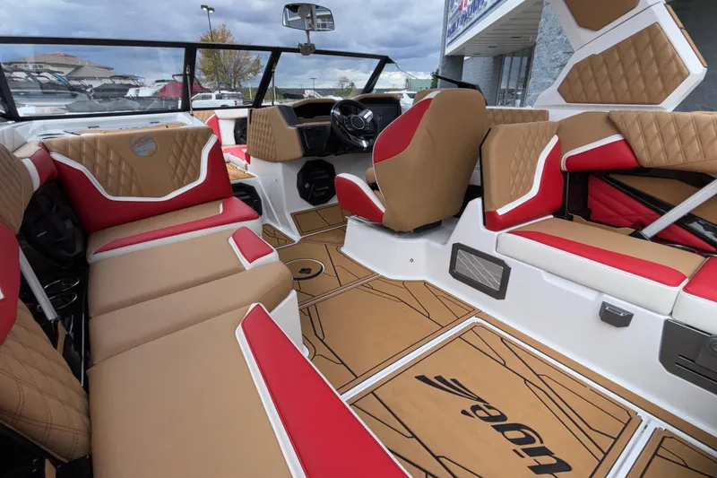 Slide: The Image of 2026 Tigé 24RZX boat interior with tan and red seating, modern design. - 34