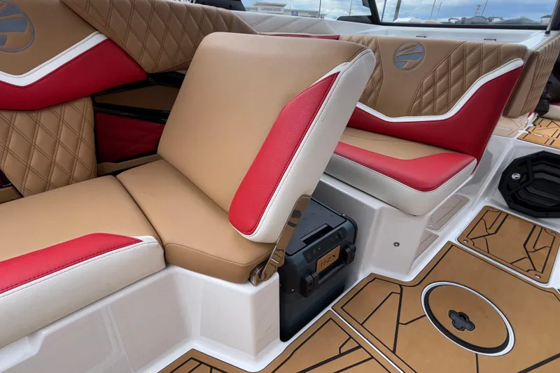 Slide: The Image of 2026 Tigé 24RZX boat interior with tan and red seating, stylish design. - 37