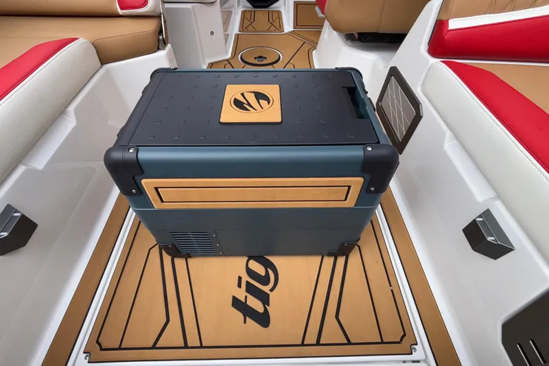 Slide: The Image of 2026 Tigé 24RZX boat interior with stylish seating and a central cooler. - 40