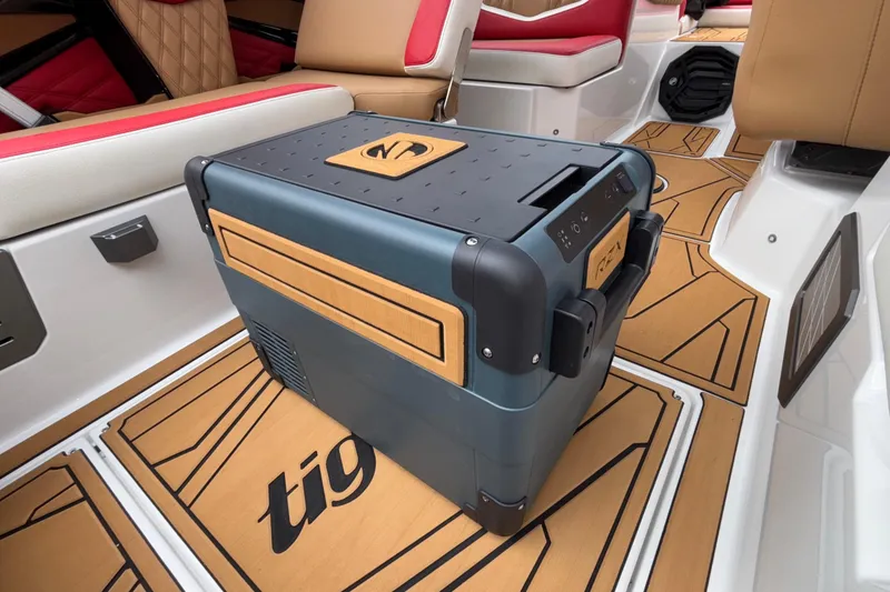 Slide: The Image of 2026 Tigé 24RZX boat interior with a portable cooler on custom flooring. - 41