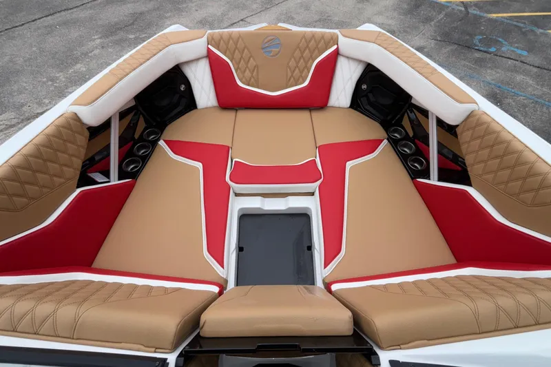 Slide: The Image of Luxurious interior of 2026 Tigé 24RZX boat with tan and red seating. - 49