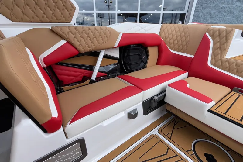 Slide: The Image of 2026 Tigé 24RZX boat interior with luxurious red and tan seating. - 9