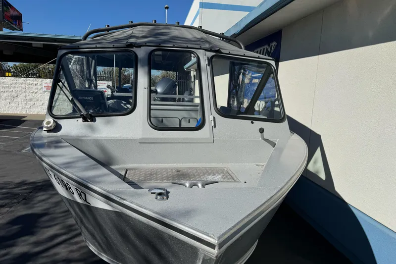 Slide: The Image of 2017 Duckworth 20 Advantage boat, silver exterior, parked outdoors in sunlight. - 5