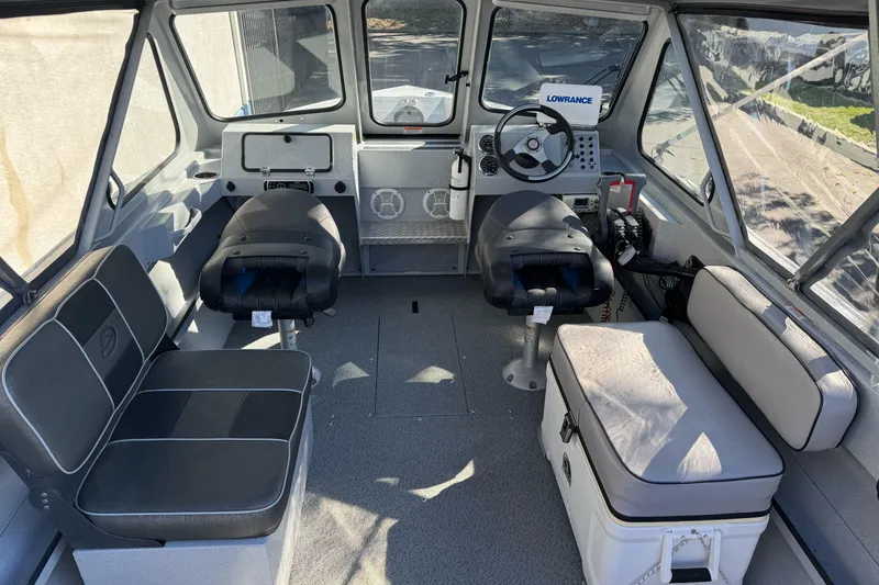 Slide: The Image of Interior of a 2017 Duckworth 20 Advantage boat with seating and steering console. - 8
