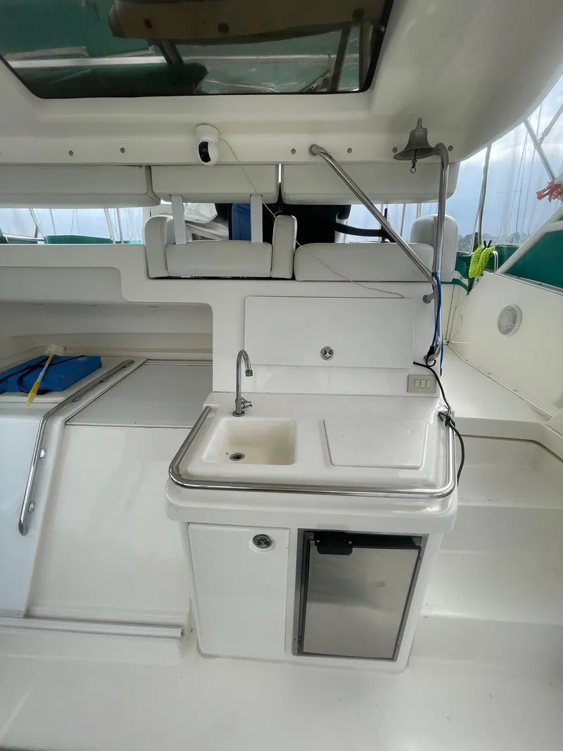Slide: The Image of 2002 Silverton 392 Motor Yacht interior with sink and mini fridge. - 17