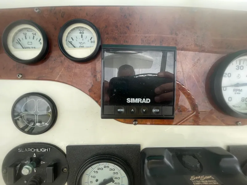 Slide: The Image of Control panel of a 2002 Silverton 392 Motor Yacht with Simrad display and gauges. - 20