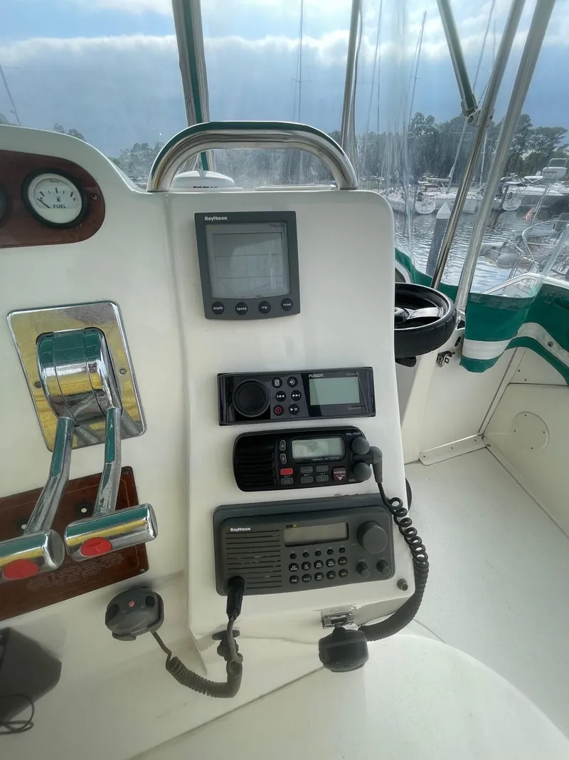 Slide: The Image of 2002 Silverton 392 Motor Yacht helm with navigation and communication equipment. - 23