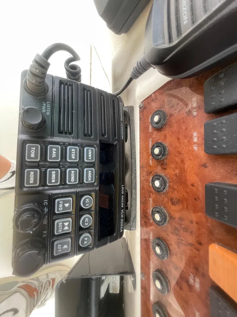 Slide: The Image of Close-up of a 2002 Silverton 392 Motor Yacht's control panel and radio system. - 24