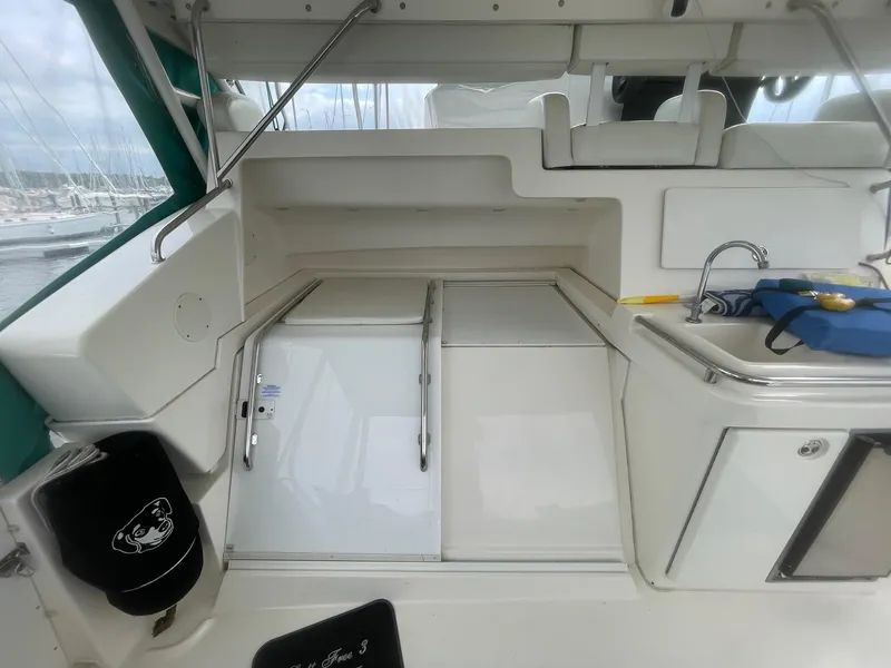 Slide: The Image of 2002 Silverton 392 Motor Yacht interior with sink and storage compartments. - 25