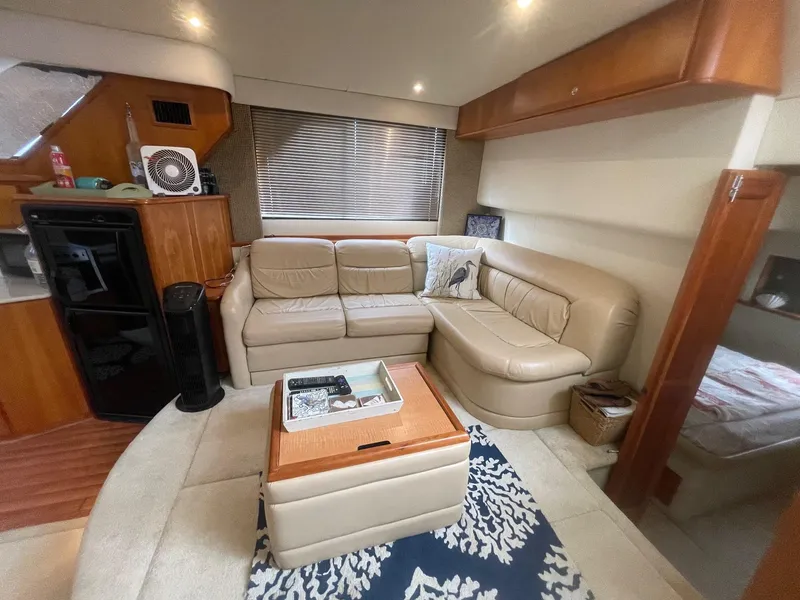 Slide: The Image of Luxurious interior of a 2002 Silverton 392 Motor Yacht with beige leather seating. - 28