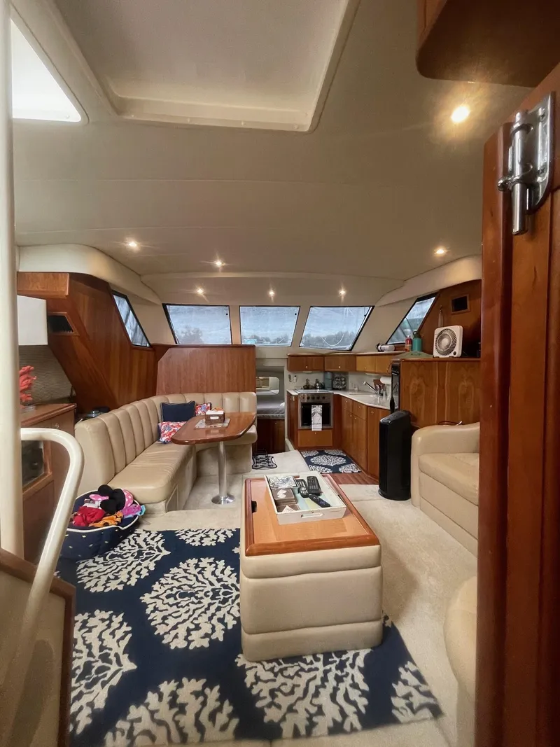 Slide: The Image of Luxurious interior of a 2002 Silverton 392 Motor Yacht with elegant seating and modern amenities. - 30
