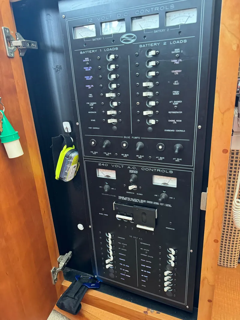 Slide: The Image of Electrical control panel inside a 2002 Silverton 392 Motor Yacht. - 38