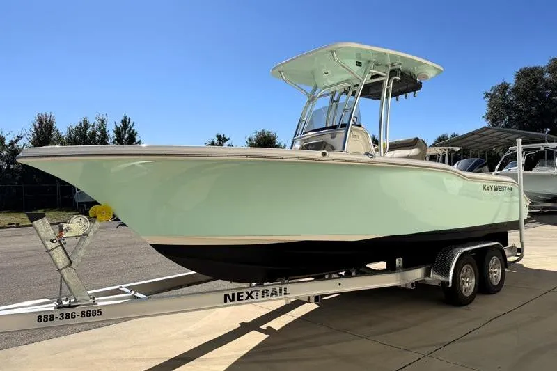 Slide: The Image of 2024 Key West 239 FS boat on trailer with Yamaha outboard motor. - 2