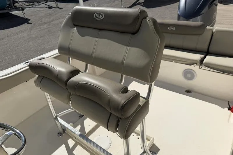 Slide: The Image of 2024 Key West 239 FS boat console with steering wheel and controls. - 23