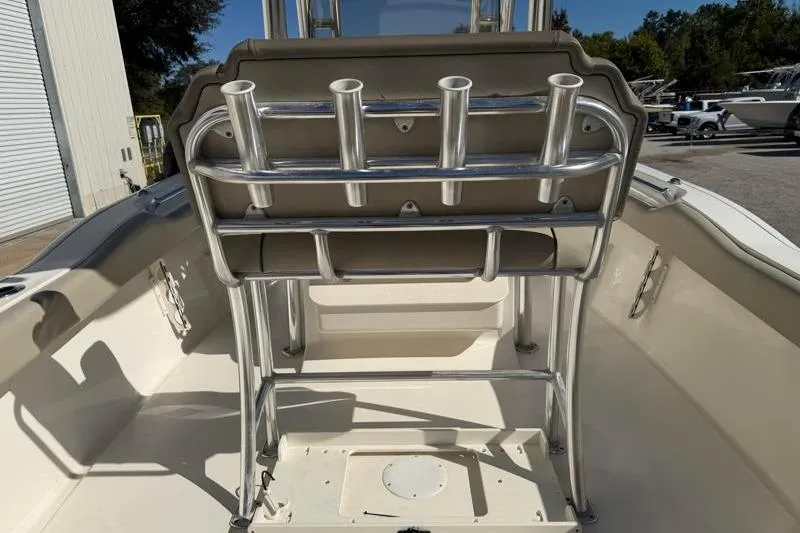 Slide: The Image of 2024 Key West 239 FS boat top view with rod holders against blue sky. - 33