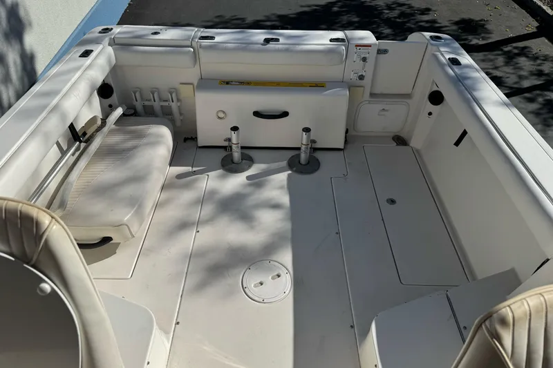 Slide: The Image of 2005 Striper SeaSwirl 2601 boat interior with seating and storage compartments. - 10