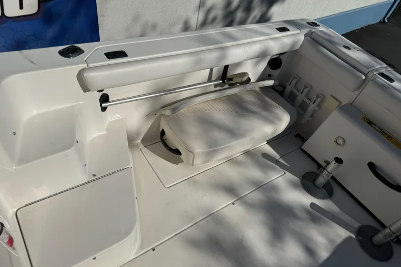 Slide: The Image of 2005 Striper SeaSwirl 2601 boat interior with seating and storage compartments. - 11