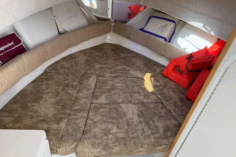 Slide: The Image of 2005 Striper SeaSwirl 2601 cabin interior with cushions and life jackets. - 18