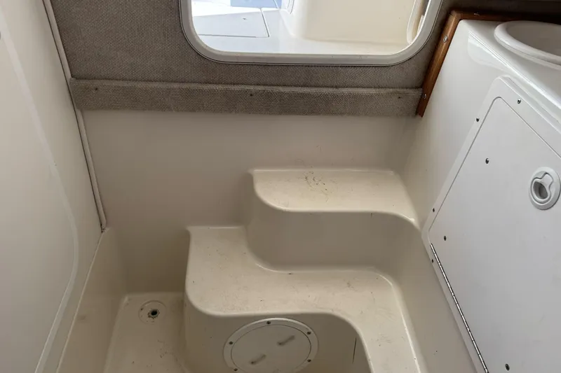 Slide: The Image of Interior steps of a 2005 Striper SeaSwirl 2601 boat cabin. - 20