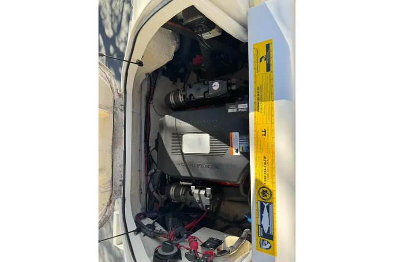 Slide: The Image of Engine compartment of a 2005 Striper SeaSwirl 2601 boat with Volvo Penta engine. - 25