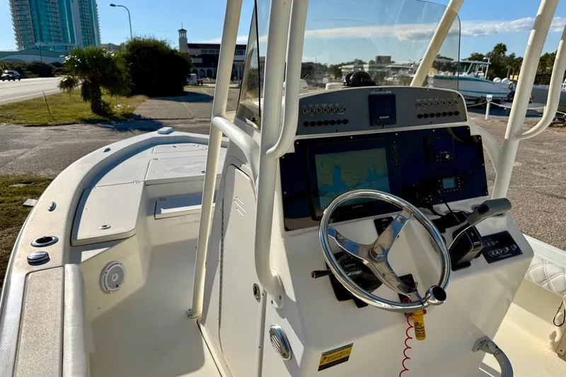 Slide: The Image of 2017 Avenger AV24 boat with Suzuki outboard motor on trailer. - 27