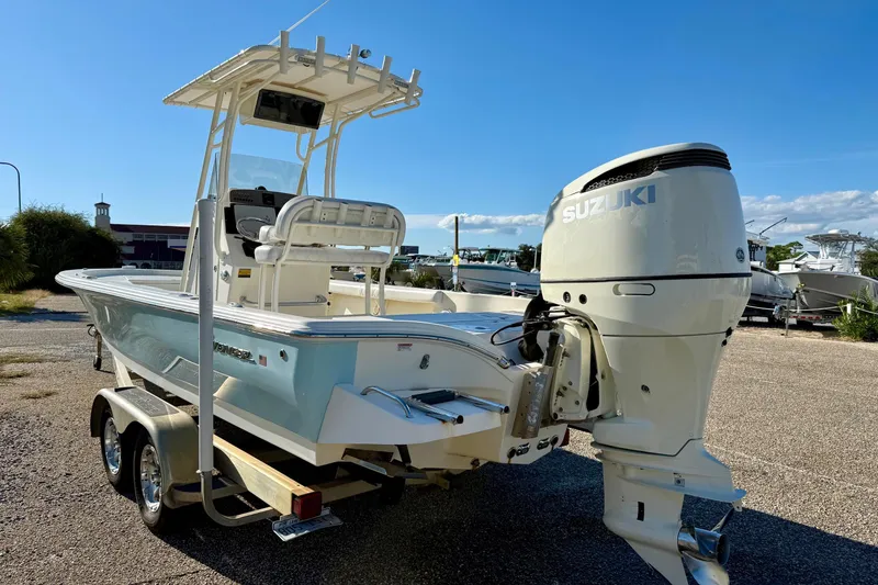 Slide: The Image of 2017 Avenger AV24 boat on trailer, rear view, parked on asphalt. - 6