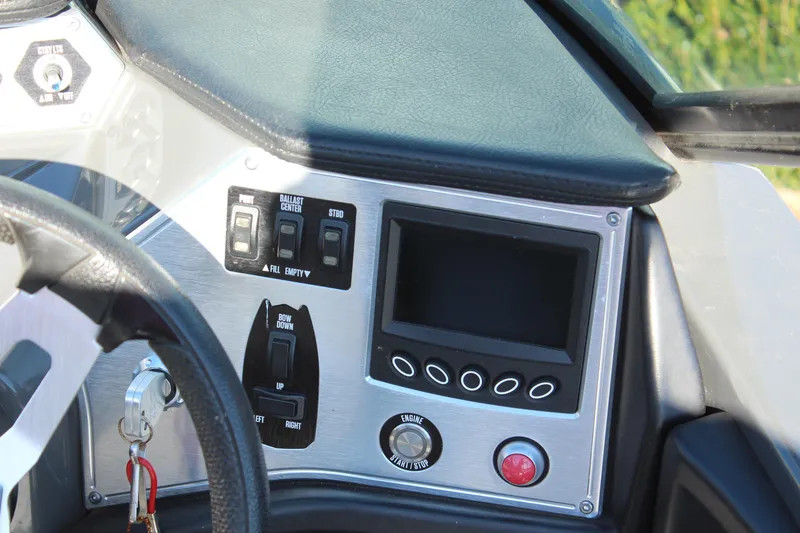 Slide: The Image of 2017 MasterCraft NXT22 dashboard with controls and display screen. - 14