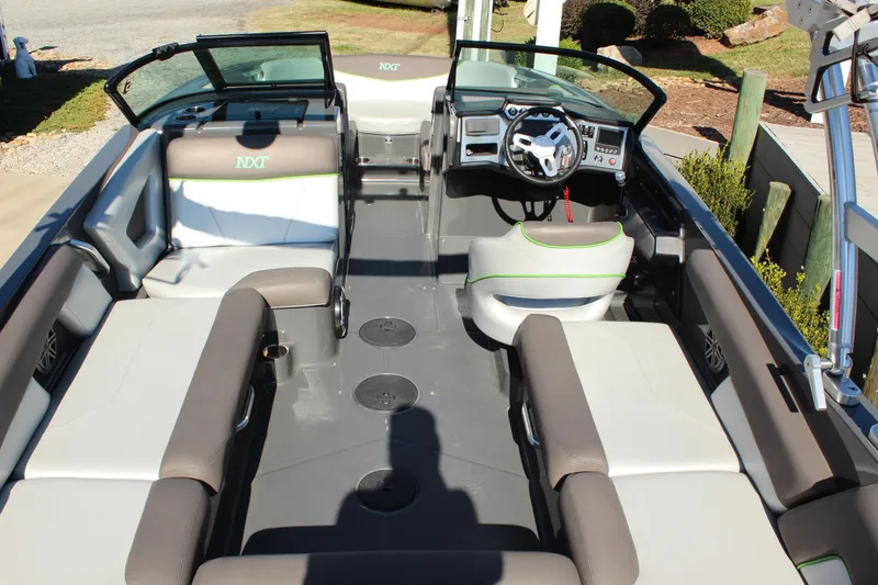 Slide: The Image of 2017 MasterCraft NXT22 boat interior with seating and steering wheel. - 7